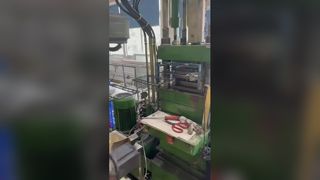 Actual shooting of the automated production process for black label label application, plastic moldi