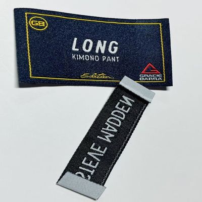 Ultrasonic Cut Embroidered Woven Clothing Labels Garment Tags Custom